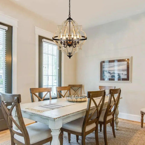 21-Inch Farmhouse Chandelier With 6-Light Rustic Wood Light Fixture For Dining Room, hanging over dining table in warm brown finish.