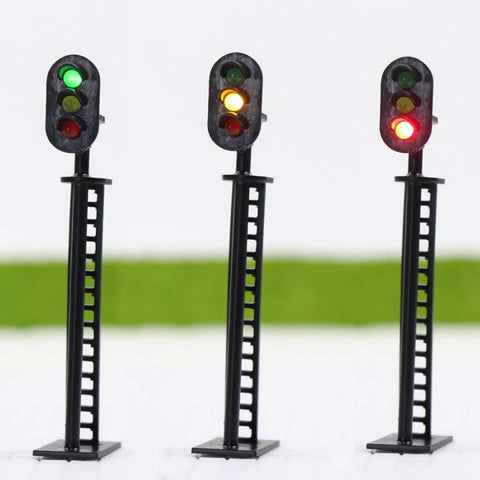 Badass 5 Piece Ho Scale 3 Light Block Signal Set Hella Durable Brass Prewired LED Railroad Lights With Red Yellow Green Bulbs 6.5cm Height For Model Trains 12V To 18V Powered Sick Upgrade For Any Layout Setup Totally Ready To Rock showcasing three signals with red, yellow, and green lights.