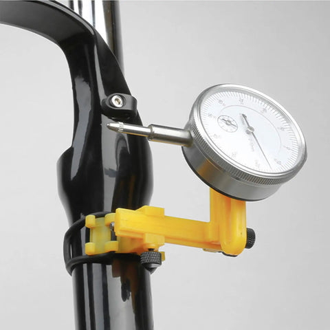 Dial indicator on Pro Grade Wheel Turning Stand for precise bike wheel alignment, scratch-resistant nylon and metal, black