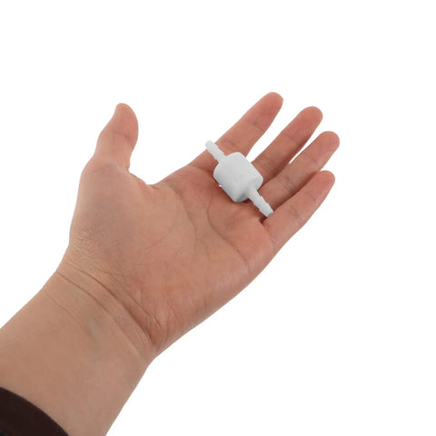 Hand holding Pro Grade Anti Drip Discharge Nozzle for Filling Machines with One Way Valve Durable PP Material Wear Resistant Industrial Replacement Part for Packaging and Chemical Filling High Precision Drip Prevention
