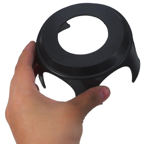 Hand holding a black flexible cup from the 10 Pack Office Chair Wheel Cups Floor Savers With Smooth As Butter Slide Motion That Quits Squeaking Blocks Grime And Delivers Built Tough Flex Shield For Heavy Duty Daily Use.