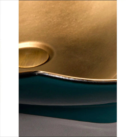 Close-up of Top Shelf Porcelain Vessel Sink For Modern Bathroom Vanity Above Counter with gold finish and curved edge.