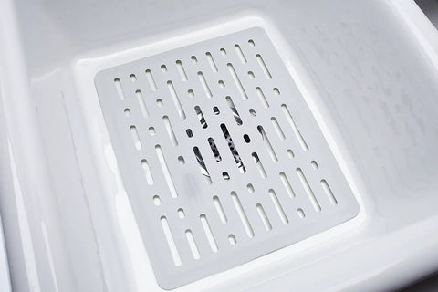 Enhanced Microbal Sink Mat Small White Kitchen Protector with raised feet in a sink, keeps area dry and space beneath clean.
