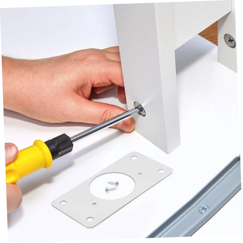 Stainless Steel Hinge Repair Plate Kit, 50 Pcs For Cupboard And Cabinet Doors being installed with screwdriver on white cabinet.