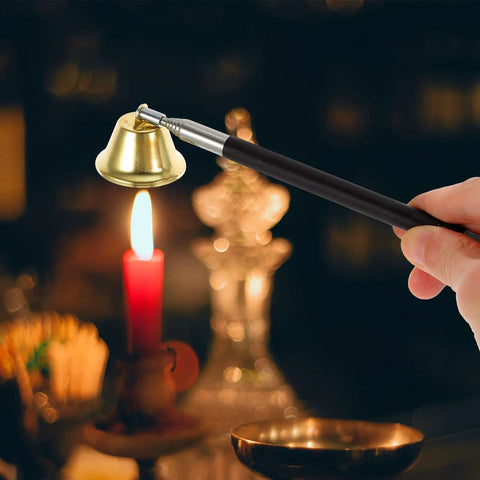The Real Deal Copper Telescopic Bell Candle Fire Extinguisher With Hella Compact Retractable Design For Quick Flame Control And Solid Home Safety Shield Plus A Tight Little Knockout Gift For Any Kitchen Or Altar Setup, held above lit candle.