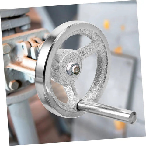 Close-up of Two Piece Beefy Carbon Steel Lathe Hand Wheel Replacement With Chrome Plated Handle attached to machine.