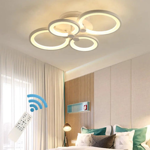 Modern Metal And Acrylic LED Flush Mount Ceiling Light With 56W Power, 3000K To 6500K CCT in a bedroom with remote control