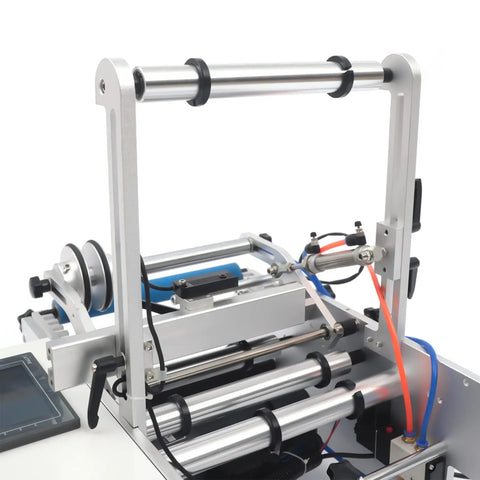 Close-up of Plug And Play Semi Automatic Round Bottle Labeling Machine 110V 300W with labeled rollers and components.