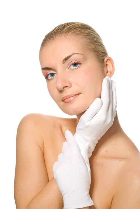 Woman wearing Six Pairs White Cotton Gloves For Dry Hands And Eczema Relief With Overnight Moisturizing Soft Liners for skincare