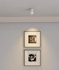 4 Pack LED COB Adjustable Ceiling Spotlight Surface Mounted 7W 3000K Warm White Aluminum Spotlight illuminating artwork on wall