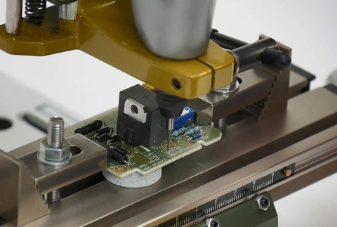 Micro Compound Table KT 70 with circuit board clamped, adjustable ruler for precise alignment on drill stands and presses