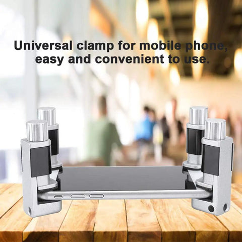4Pcs Universal Aluminum Phone And Tablet Holder Clamp With Scratch Proof Rubber Pads Heavy Duty Grip Vehicle Mount For Dashboards And Work Benches Sweet Ride Guaranteed close-up view of phone clamp on wooden surface