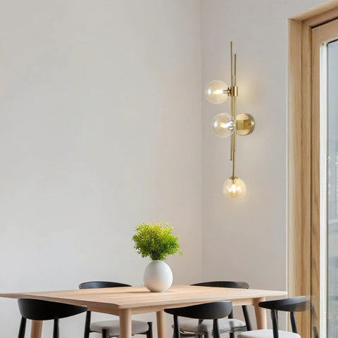 Chic Three Light Globe Glass Wall Sconces With Amber Glass Shades Mid Century Modern Indoor Wall Light Fixtures in dining room