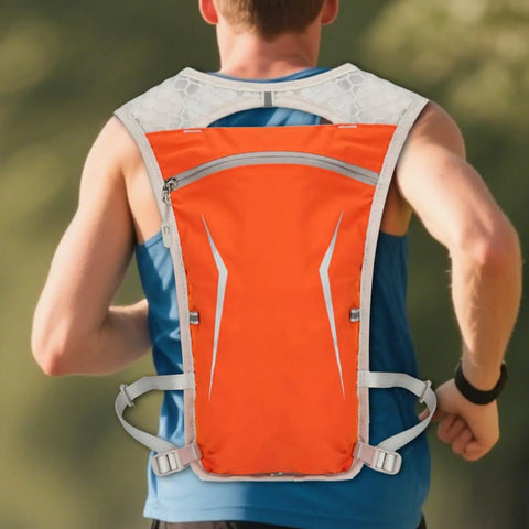 Man wearing orange Lightweight Hydration Backpack for Running and Hiking with Built In Water Reservoir Snug Fit Hydration Vest