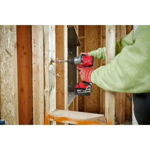 Half Inch Compact Cordless Drill Driver Kit Featuring Rock Solid Metal Chuck And Carbide Teeth For Ultimate Bit Retention drilling into wood.