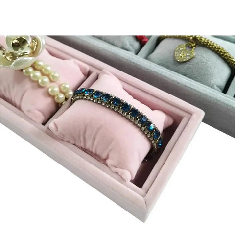 Keep Your Daily Carry Looking Sharp With This Grey Velvet Watch Tray And Jewelry Organizer Set Featuring Four Spacious Grids Wrapped In Plush Mini Pillows For Sleek Bracelet Display And Zero Clutter, showing blue jeweled bracelet and pearl jewelry in soft cushions.