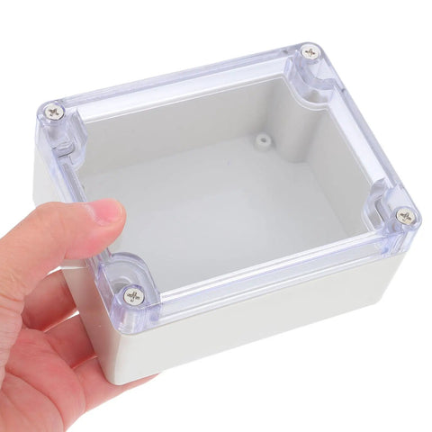 Heavy Duty Waterproof Plastic Junction Box With Tough Cover For Electrical Projects, held in hand, with transparent lid for monitoring.
