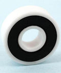 Close-up of 6901-2RS ZrO2/Si3n4 Full Ceramic Bearing PTFE based Grease featuring a white outer ring and black inner ring.