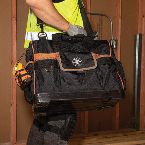 Tradesman Pro Wide Open Tool Bag With 1680 Ballistic Weave Molded Bottom in construction site setting
