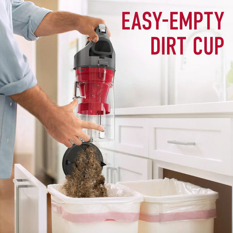 Hoover Rewind Pet Upright Bagless Vacuum Cleaner For Carpet And Hard Floors With Automatic Cord Rewind And Above Floor Cleaning Capability In Sleek Gray Finish emptying dirt cup into trash.