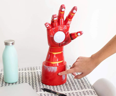 Iron Man Gauntlet LED Mood Light Desk Lamp For Marvel Fans, Totally Lit Repulsor Glow Night Light on a desk being turned on.