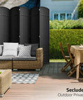 8 Panel Black Room Divider With Double Hinged Panels, 6 Ft Tall Folding Privacy Screen creating a secluded outdoor space