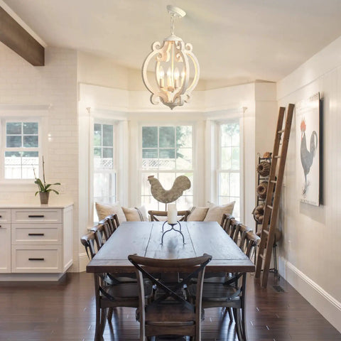 Farmhouse Rustic White Wood Orb Pendant Chandelier For Kitchen Island And Living Room Vintage Vibe 4 Light Fixture hanging in dining area