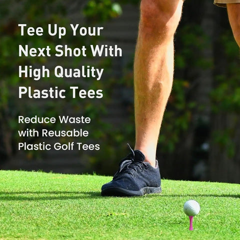 Golfer preparing to tee off with Castle Golf Tees Set, Durable Plastic Step-Down Tees, pink tee visible on grass
