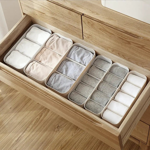 Stackable Plastic Underwear Storage Containers With Divided Compartments To Straighten Up Your Wardrobe Kick Clutter To The Curb Keeping Socks Bras Neck Ties Squeaky Fresh organized in wooden drawer.