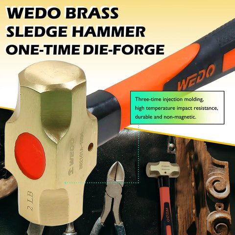 Brass Sledge Hammer With Fiberglass Handle Die Forged And Corrosion Resistant For Heavy Duty Jobs DIN Standard 2 Lb Weight And 14 Inch Length Non Magnetic Tool Built Tough For Real Heavy Hits displayed with tools.