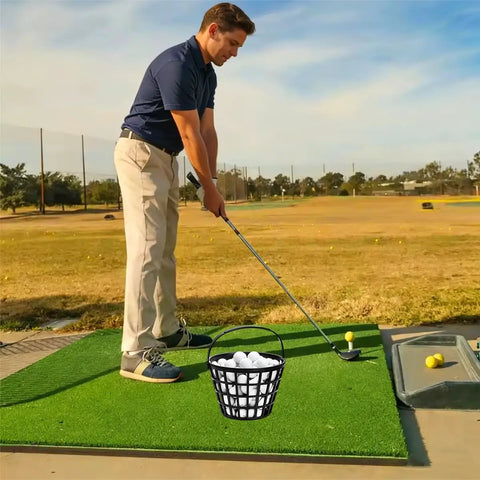 Portable Golf Ball Basket With Handle Holds Up To 50 Balls, black ball bucket at golf range with golfer in practice