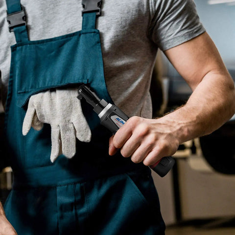 Person holding Compact 12V Cordless Ratchet Wrench with 1/4 Inch Alloy Head 30 Ft-Lbs Torque Built-In LED Light