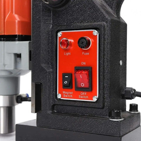 Control panel of Kickass 1100W Magnetic Drill Press with switches for light, magnet, and power settings.