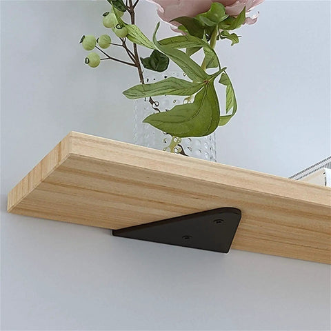 Heavy Duty Concealed Floating Shelf Brackets installed with a wooden shelf, showcasing a sleek black triangle mount.