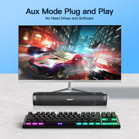 USB Computer Speakers With 3.5mm Aux, Wired USB Powered Sound Bar With Colorful LED Lights And Switch Button shown under monitor
