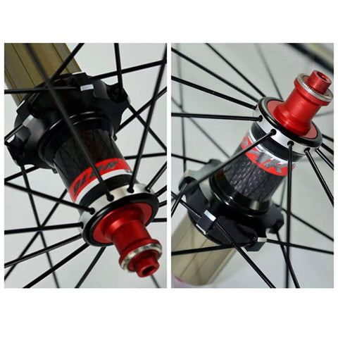 Close-up of 700C Road Wheelset With Front 100mm And Rear 130mm Quick Release Hubs 30mm Deep Aluminum Rim Carbon Blend Build Sealed Bearings