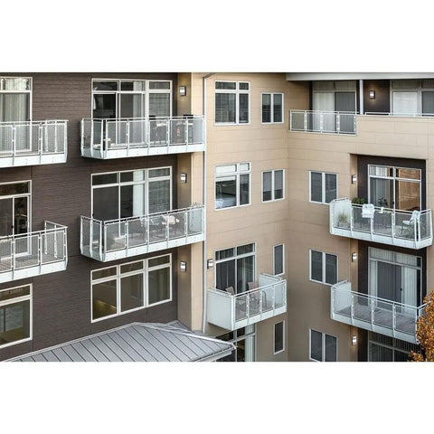 Outdoor Wall Light LED 13 Inch Textured Black With Integrated 3000K Glow on modern apartment building