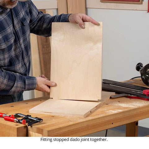 Fitting stopped dado joint with 32 Inch Router Dado Jig for precise woodcuts on plywood, showcasing clamping and alignment.