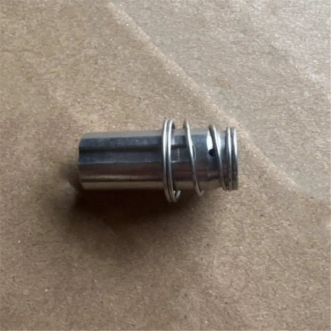 Close-up of spool and spring from Solenoid Valve Kit With Pilot Head For Pneumatic Systems, Iron Core 8320G Series SCG353A047.