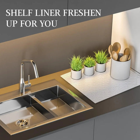 Premium White Non Adhesive Shelf And Drawer Liner For Kitchen Cabinets PVC Based Non Slip Organizer Roll positioned near kitchen sink.