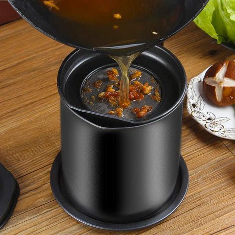 Pouring grease into Sizzlin Bacon Grease Catcher With Fine Mesh Filter Seven Cup Heavy Duty Iron Fat Jar, nonstick and easy to clean.