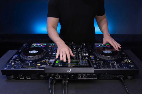 Four Deck All In One DJ System With A 10.1 Inch Touchscreen in use, showing Performance Pads and control layout.
