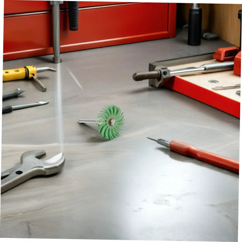 Radial Bristle Disc For 3Mm Shank Kit With 1 Inch Rotary Tools and small spiral flap wheel on workbench with tools.