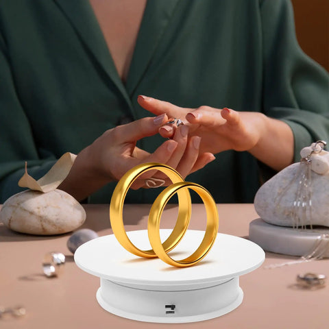 Motorized Rotating Display Turntable Adjustable Speed Electric Platform For Jewelry Watches And Cosmetics With Stable Base showcasing two gold rings.