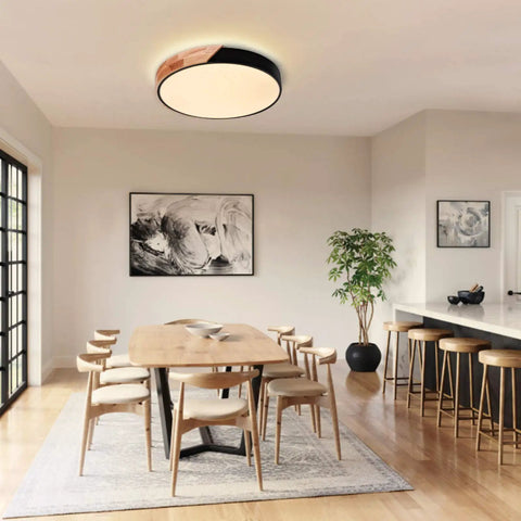 Dimmable 15 Inch Round LED Ceiling Light With Remote Control, installed over a dining table in a modern room setting