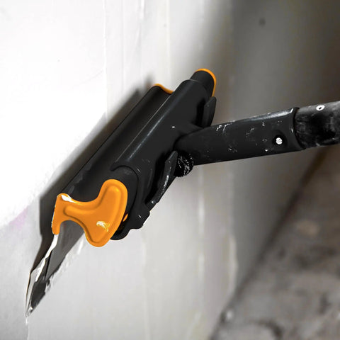 Pro Grade 16 Inch Drywall Skimming Blade With Extruded Aluminum Back And European Stainless Steel Blades in use on wall