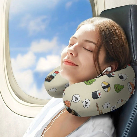 Woman using Women's Travel Neck Pillow Memory Foam U Shaped with cute sushi pattern on an airplane.
