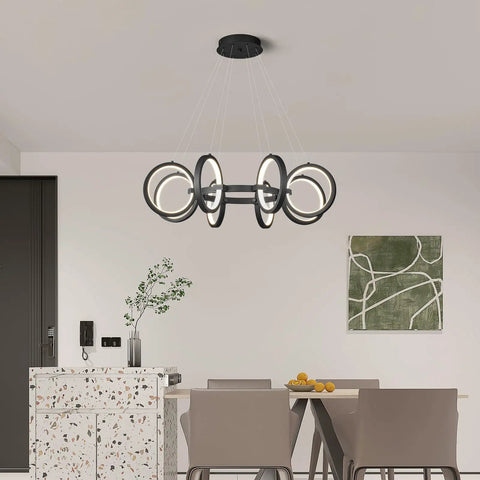 Dope Modern LED Chandelier With Six Black Ring Pendant Lights in dining room, minimalist round fixture over table.