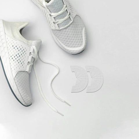 Premium Rubber Sole Protectors For Sneakers And Boots With 4mm Anti Scuff Heel Pads beside white running shoes on white background.