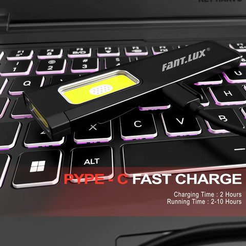 Pocket EDC Flashlight With USB C Rechargeable Power on laptop keyboard, showing charging cable connected
